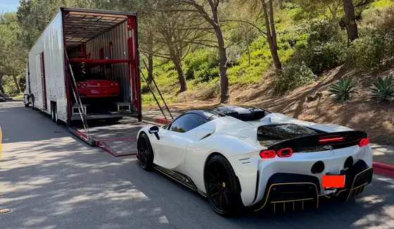 Ferrari SF90 Spider loading into a Cavalier enclosed trailer